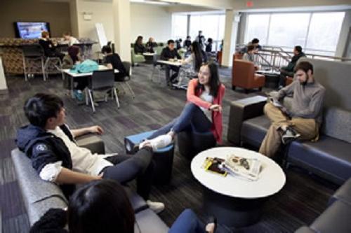 Students relaxing in millstream hall great room